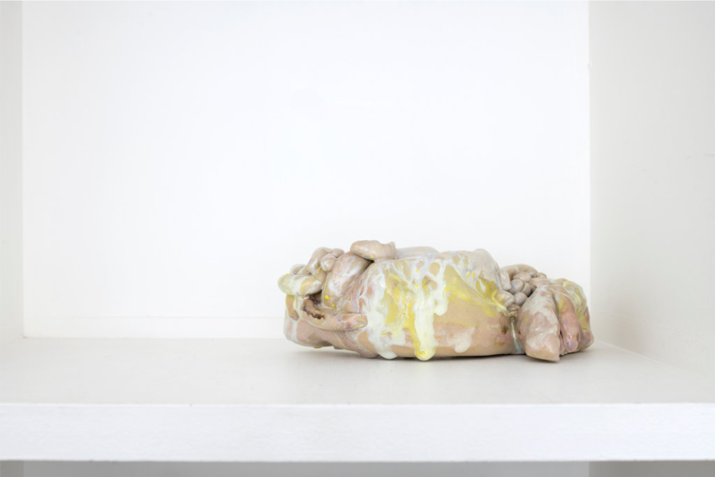 Glazed ceramic sculpture by German artist Isa Melsheimer dating from 2019 representing a yellow and pink bacterial form.