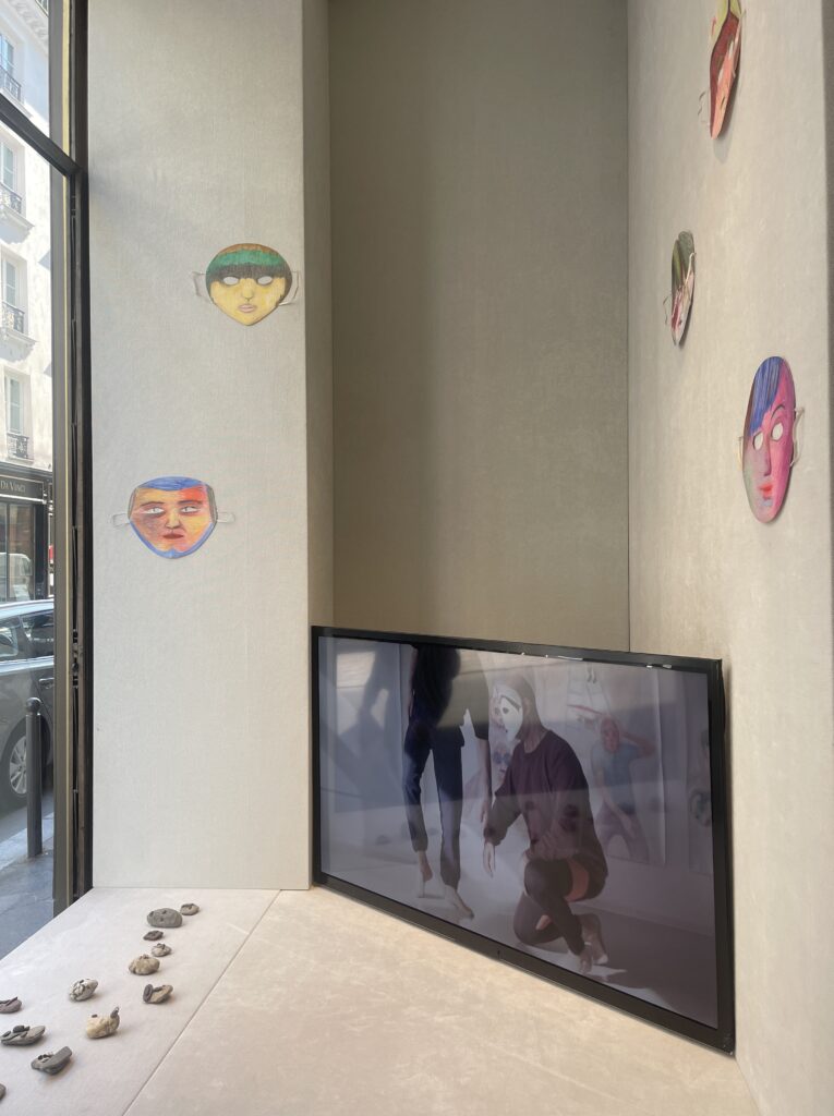 View of the exhibition There are Eyes by Prinz Gholam View of Prinz Gholam's exhibition There are Eyes, showing stone sculptures, masks drawn with coloured pencils and a video extract from a performance.