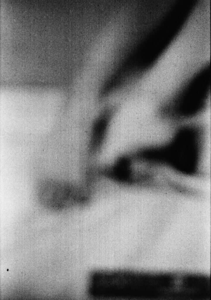 Black and white silver photograph under dielectric glass by Mélissa Boucher representing feet